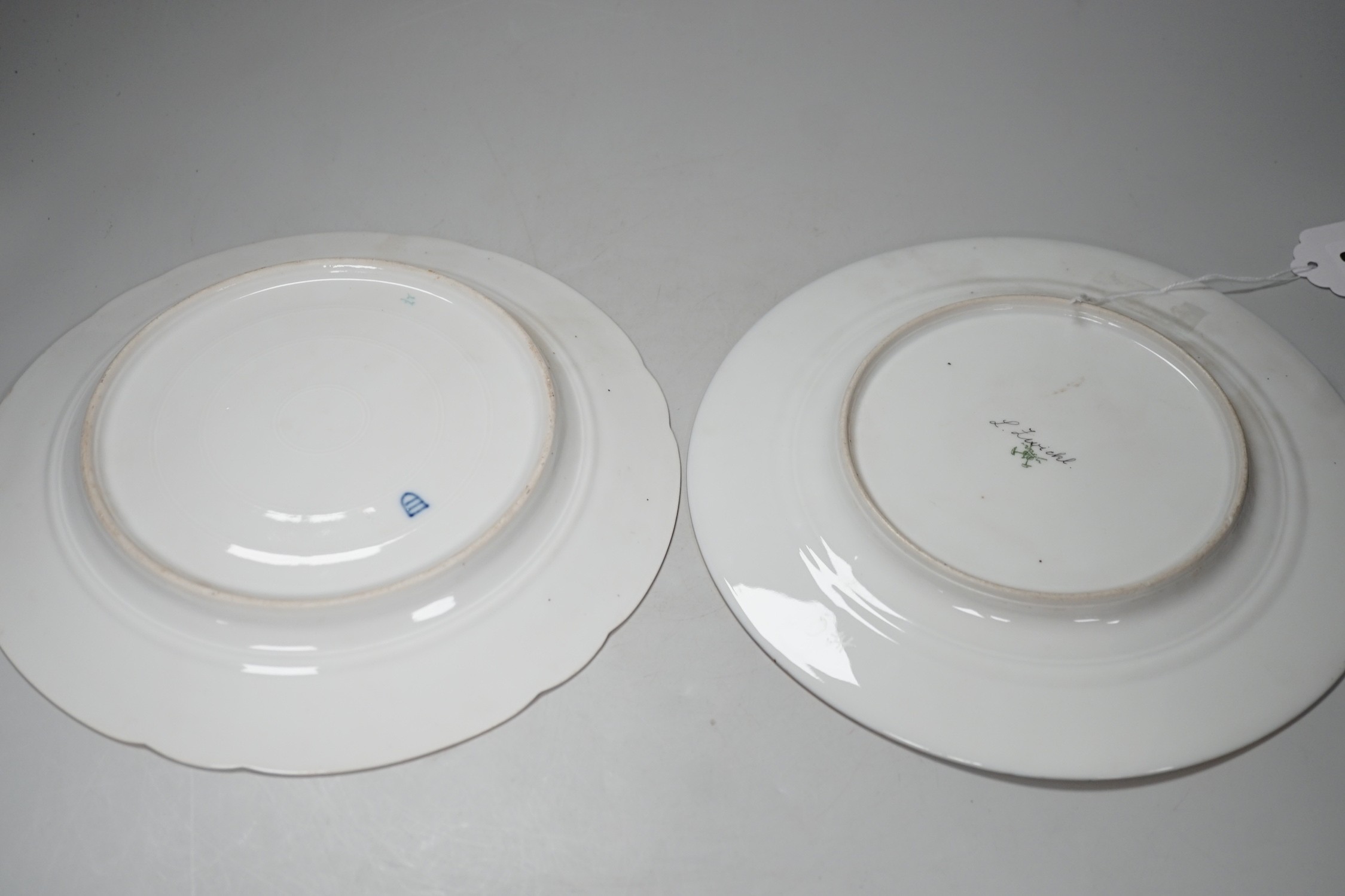 A Vienna style painted portrait plate, and another Vienna style plate both signed, largest 25cm diameter